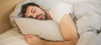 Peaceful man sleeping soundly after taking magnesium glycinate for better sleep and relaxation
